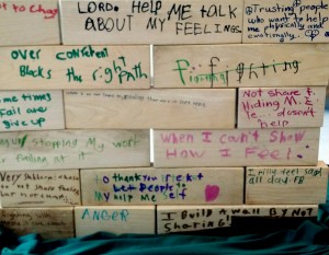 The children each wrote down something on their "brick" in the wall that they felt was keeping them from having a better relationship with God and others