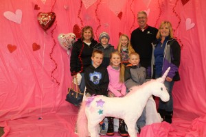 members of the youth group "SPARK" pose for a picture before helping clean up. They also brought flowers and Valentine's goodies for all of the children!